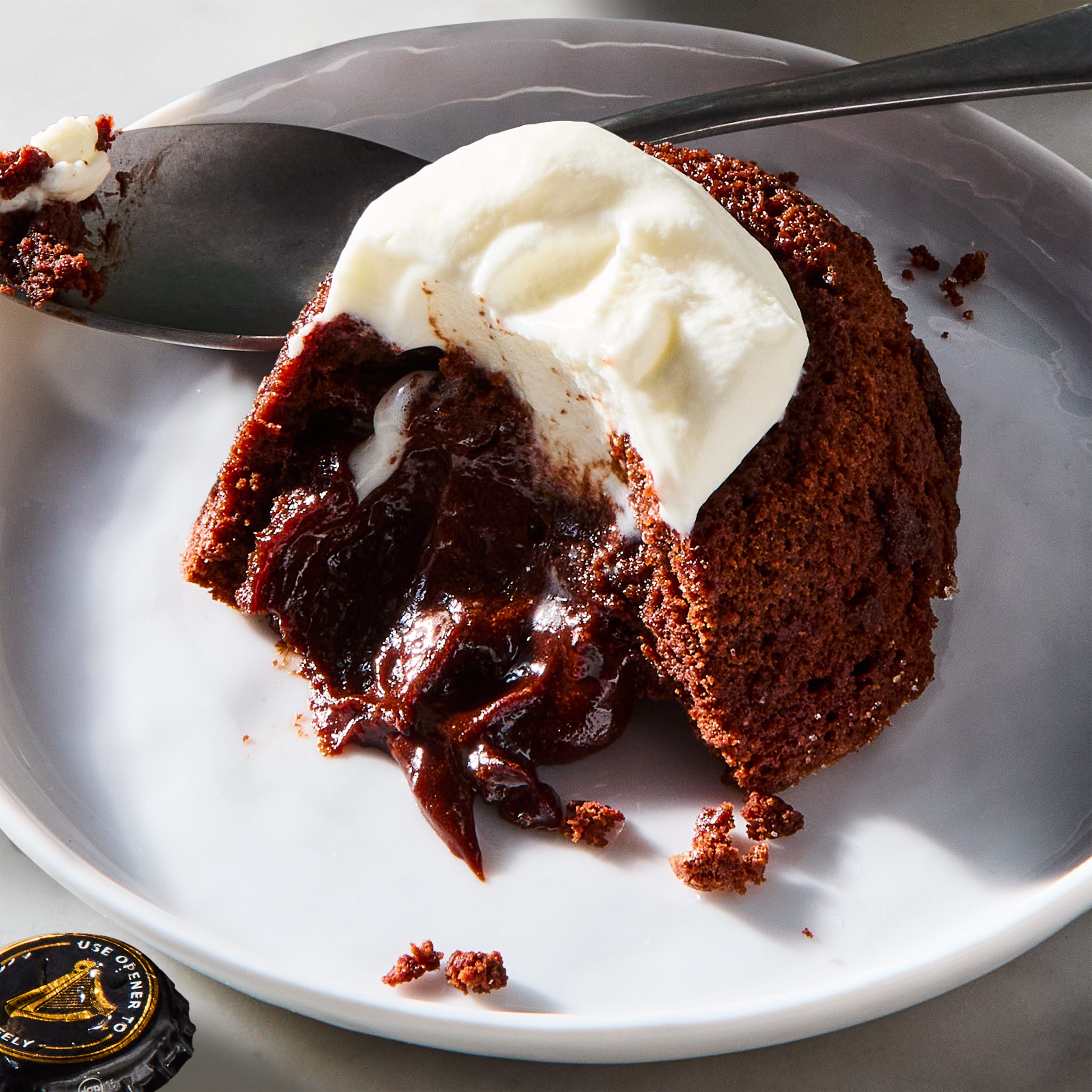 chocolate guinness lava cakes topped with whipped cream