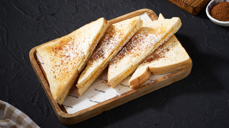 tray of cinnamon sugar toast on black background