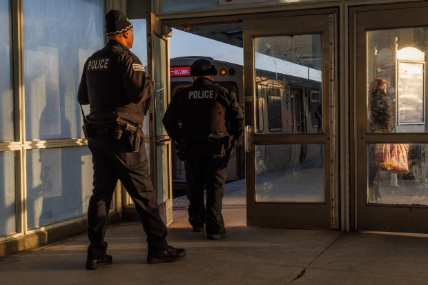 Chicago police walk near a platform at the CTA Red Line 69th Street station, Feb. 12, 2026. (Armando L. Sanchez/Chicago Tribune)