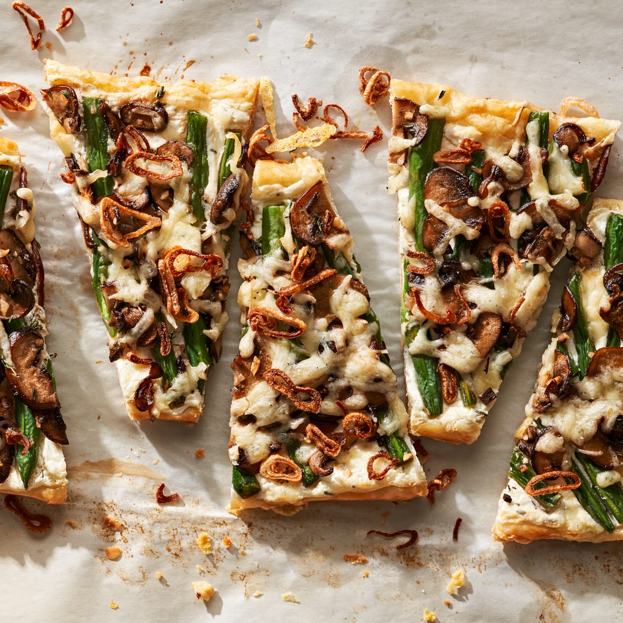 cheesy green bean and mushroom tart with crispy shallots