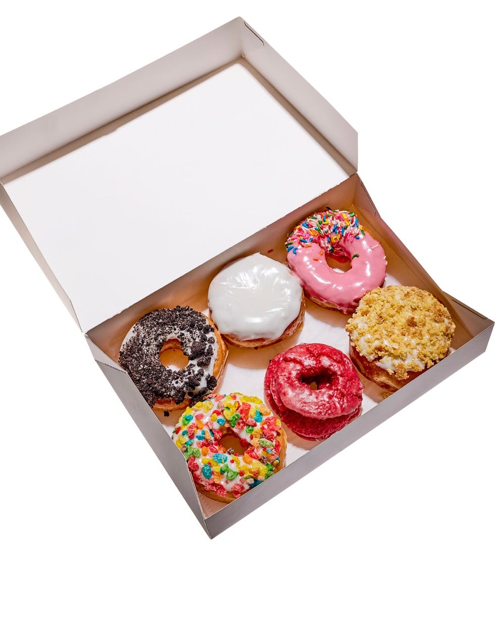 box containing assorted donuts with different toppings