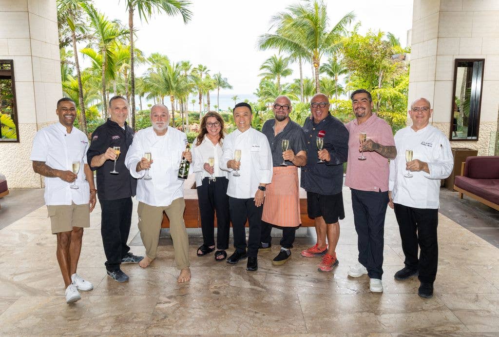 Chefs toast with champagne during the festival at Atlantis Paradise Island 