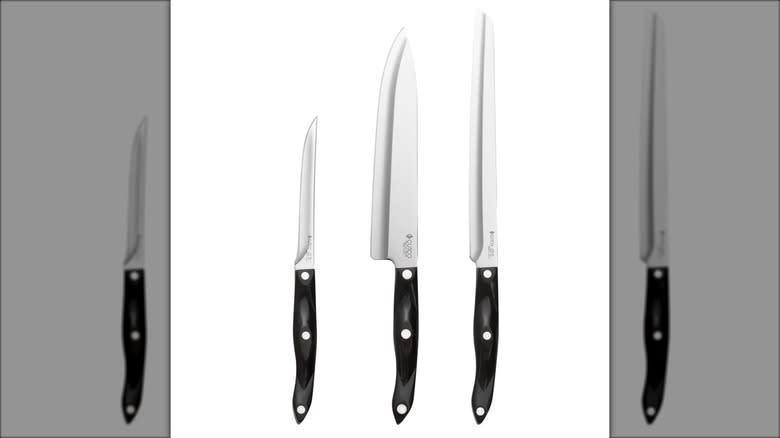 Three types of kitchen knives with black handles against white background.