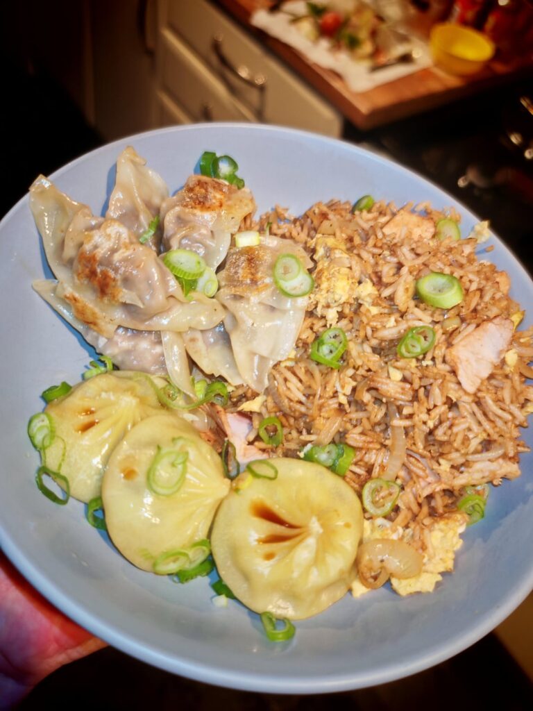 Homemade pork fried rice served with beef dumplings and chicken soup dumplings