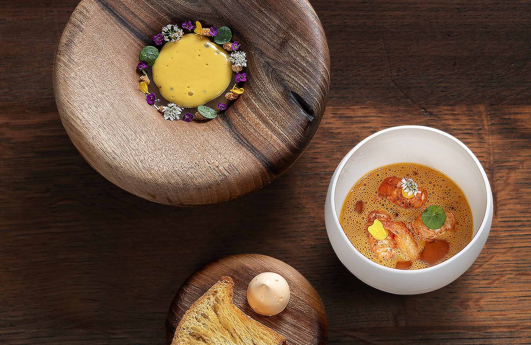 Rhône crayfish tartare, mandarin and marigold whipped butter and shellfish jus at the Three-Star Les Morainières restaurant in France. © Pascal Etienne Lattes/Thuries Magazine/Les Morainières