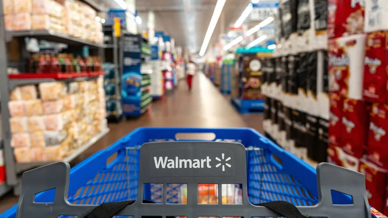 A Walmart shopping cart in a home goods aisle