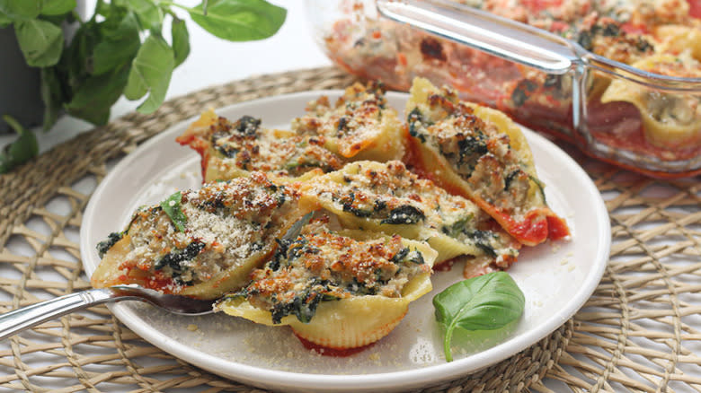 Baked spinach and ricotta-stuffed shells on plate