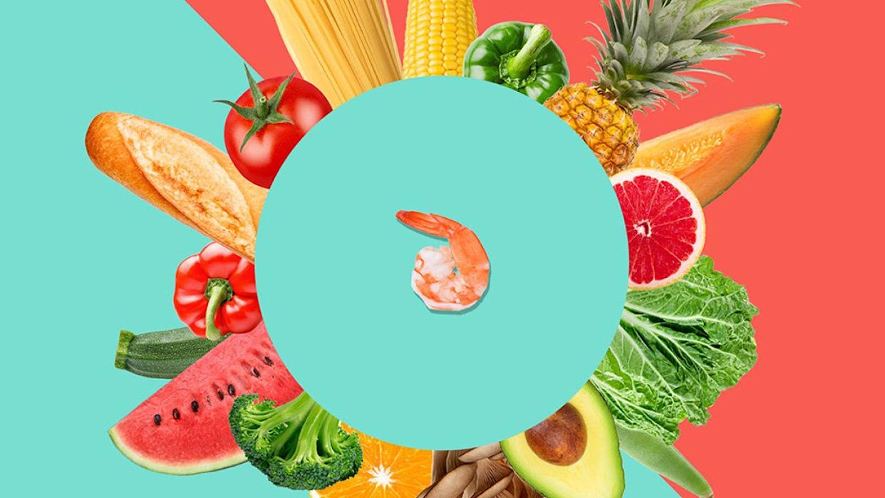 Bread, grains, fruits, and vegetables arranged in a circular pattern around a shrimp at the center.  -  Knowable Magazine