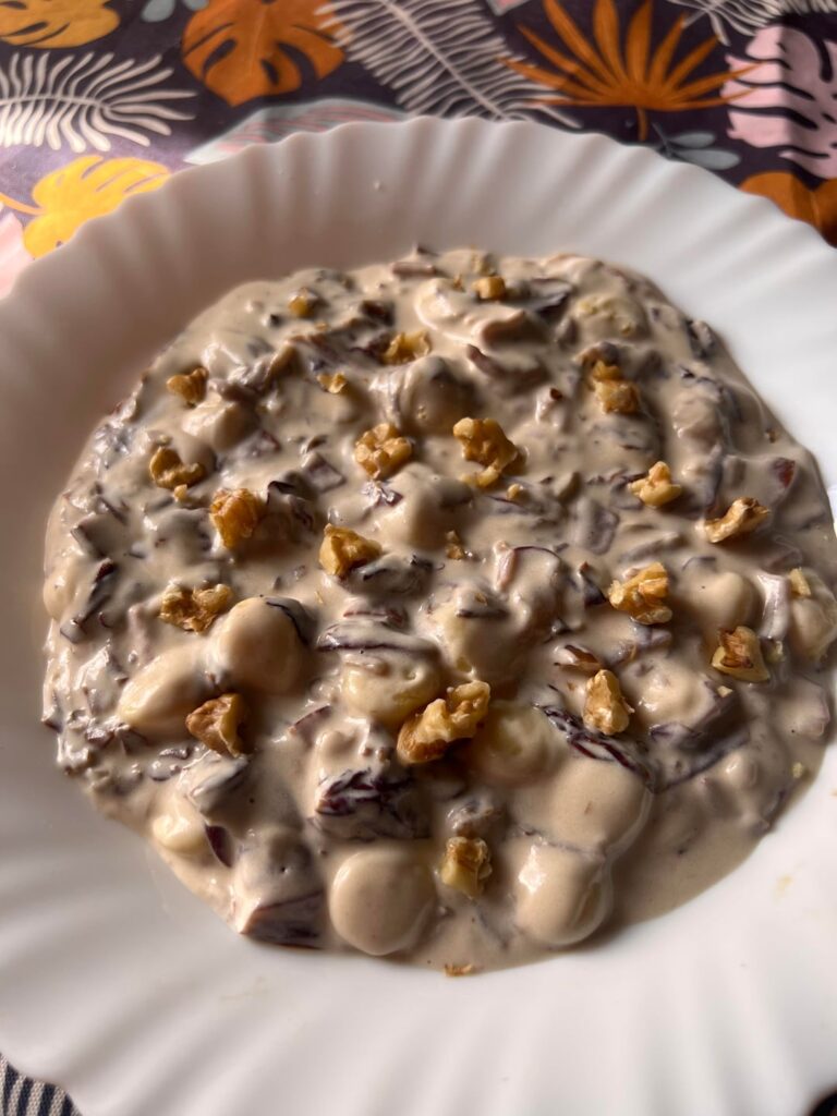 Gnocchetti with speck, radish, mascarpone cheese and nuts as decoration