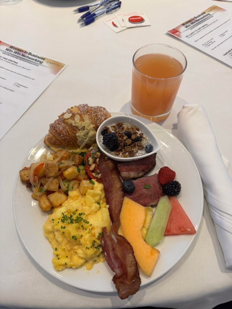 Honey dijon glazed beef brisket, maple cured bacon, scrambled eggs and chives, home fries, herb roasted tomato, coconut chia pudding, fresh fruit, almond croissant, orange juice at Malaparte in Toronto