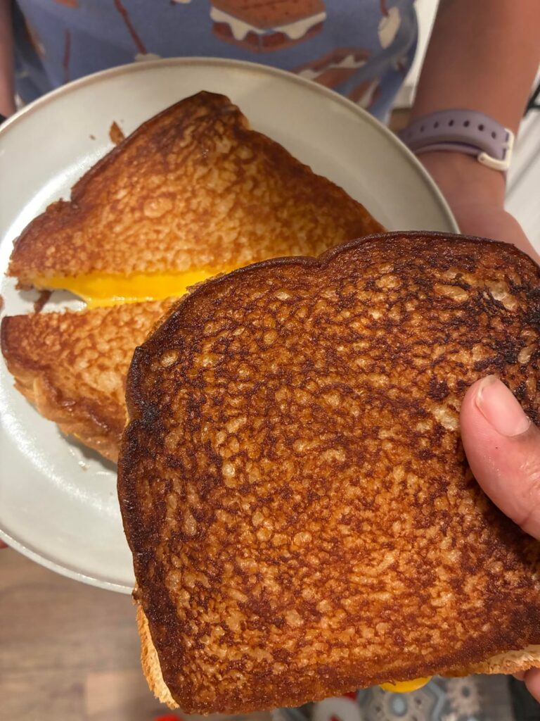 I started doing pre-bed time grilled cheese with my niece when I babysit and she is getting so good.