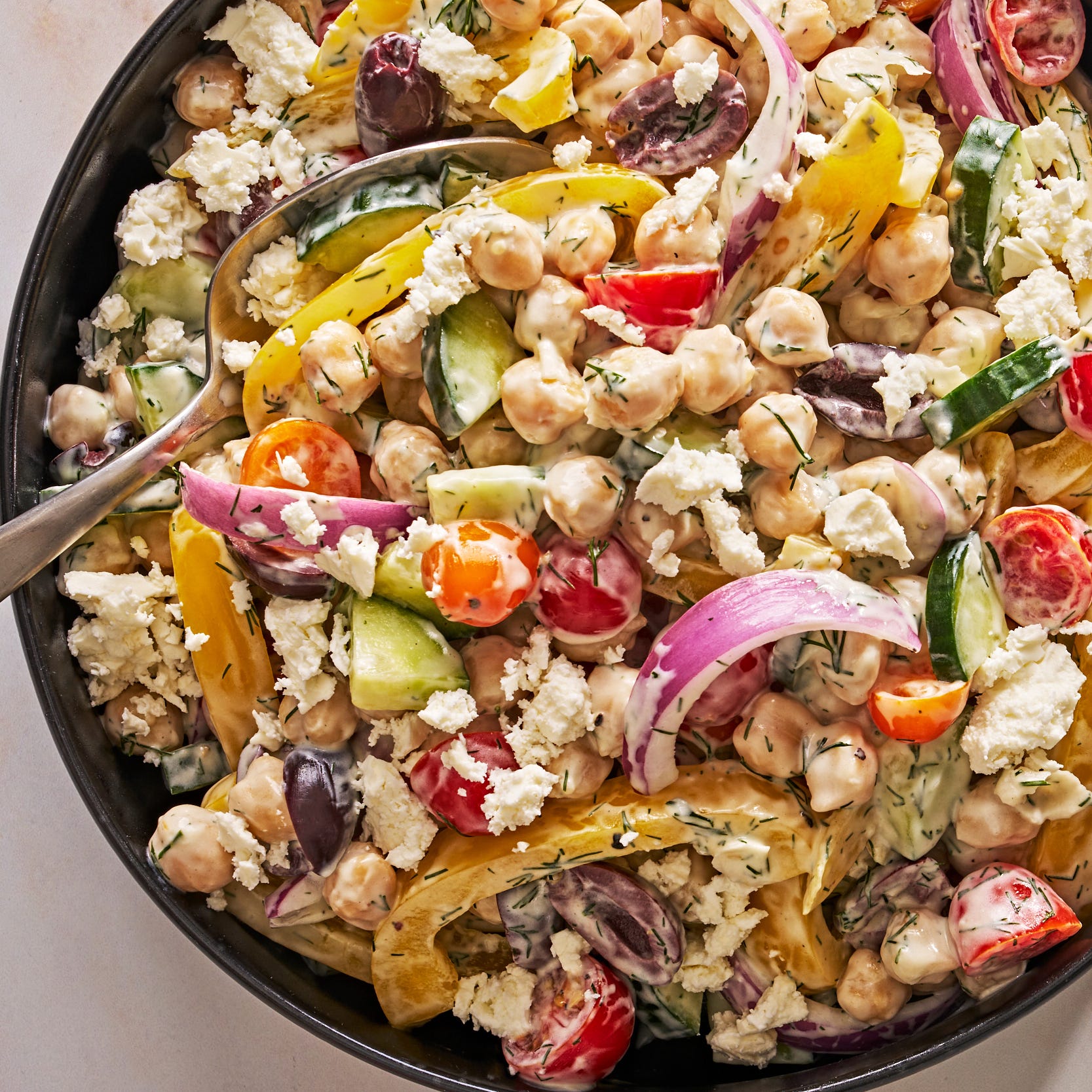 creamy greek chickpea salad with crumbled feta