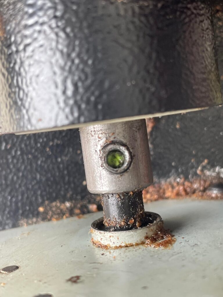 How the heck do I remove this Auger bolt from my Traegar Grill if the screw head is totally stripped?