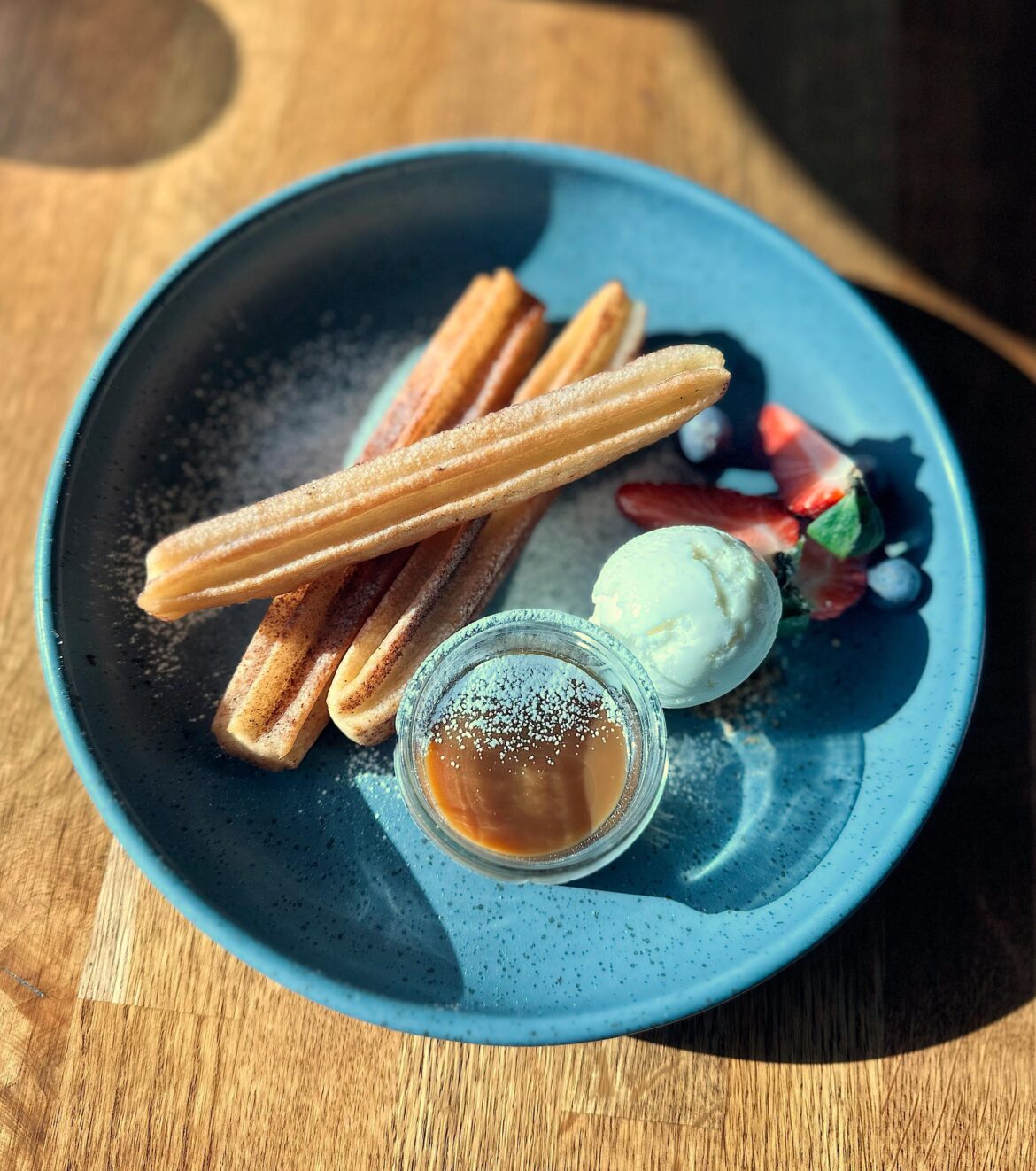 Churros with caramel sauce and ice cream