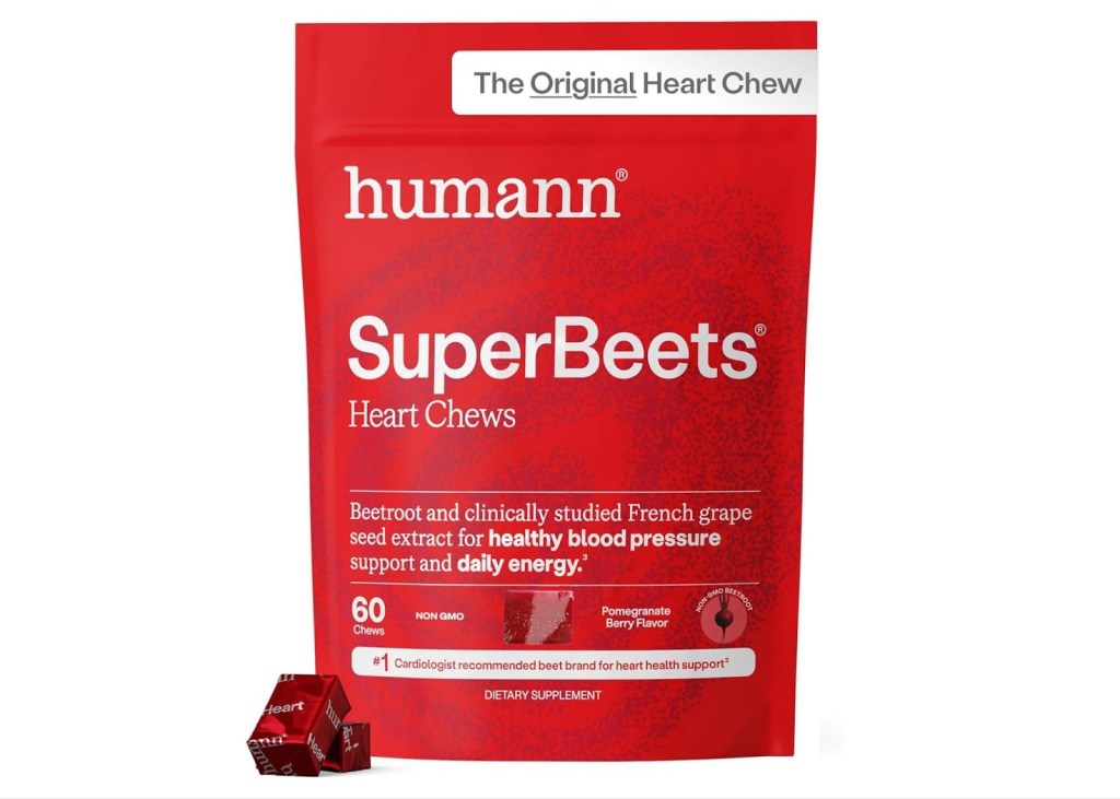 A red pouch of Humann SuperBeets Heart Chews, a dietary supplement, with two individually wrapped chews next to it.