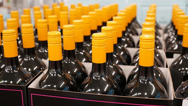 Wine bottles with yellow screw-caps