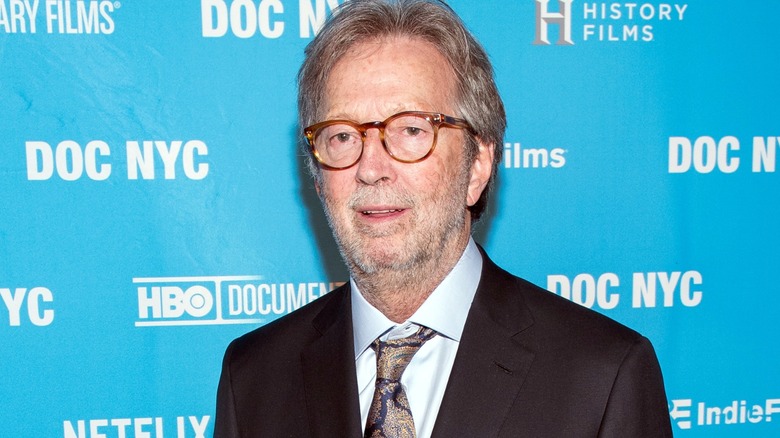 Eric Clapton smiling at a red carpet event