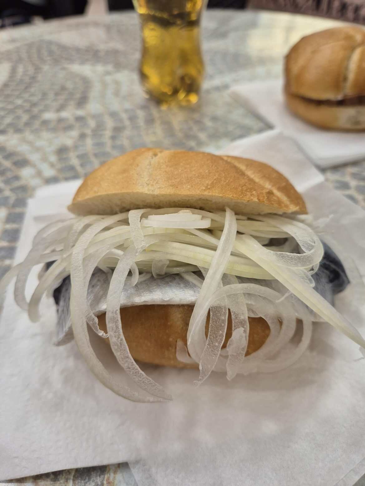 Ordered a Fish sandwich in Germany and said "yes" when asked if I wanted onions