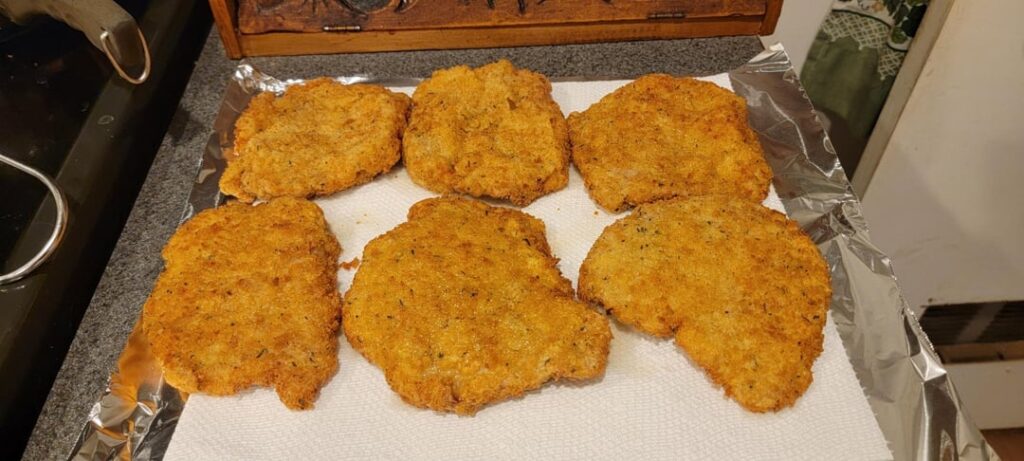 Pork Schnitzel, Herb and cheese potatoes, broccoli, and mushroom gravy.