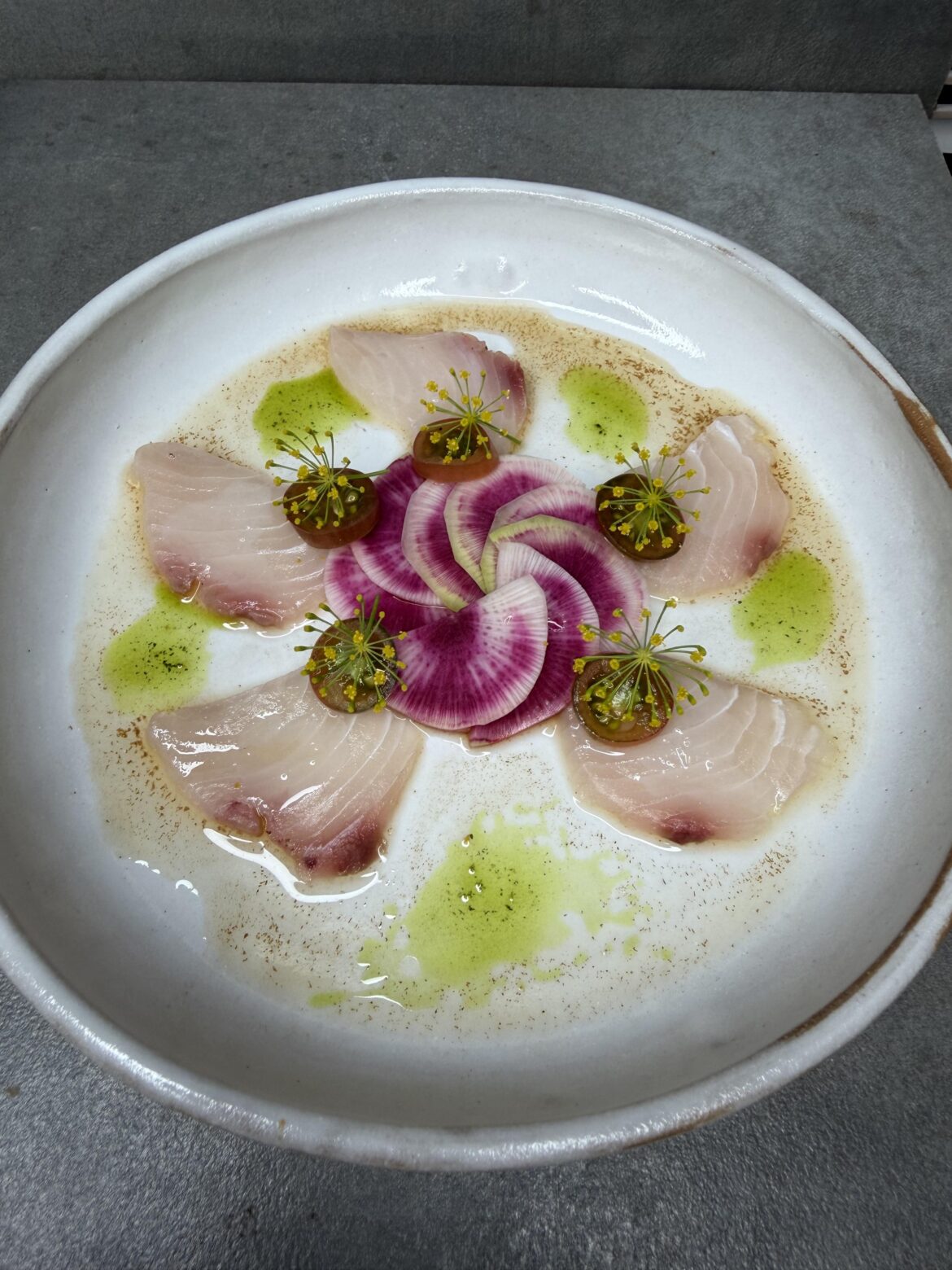 Bonito Crudo with watermelon radish, tomato, champagne vinegar, dill oil and dill flowers