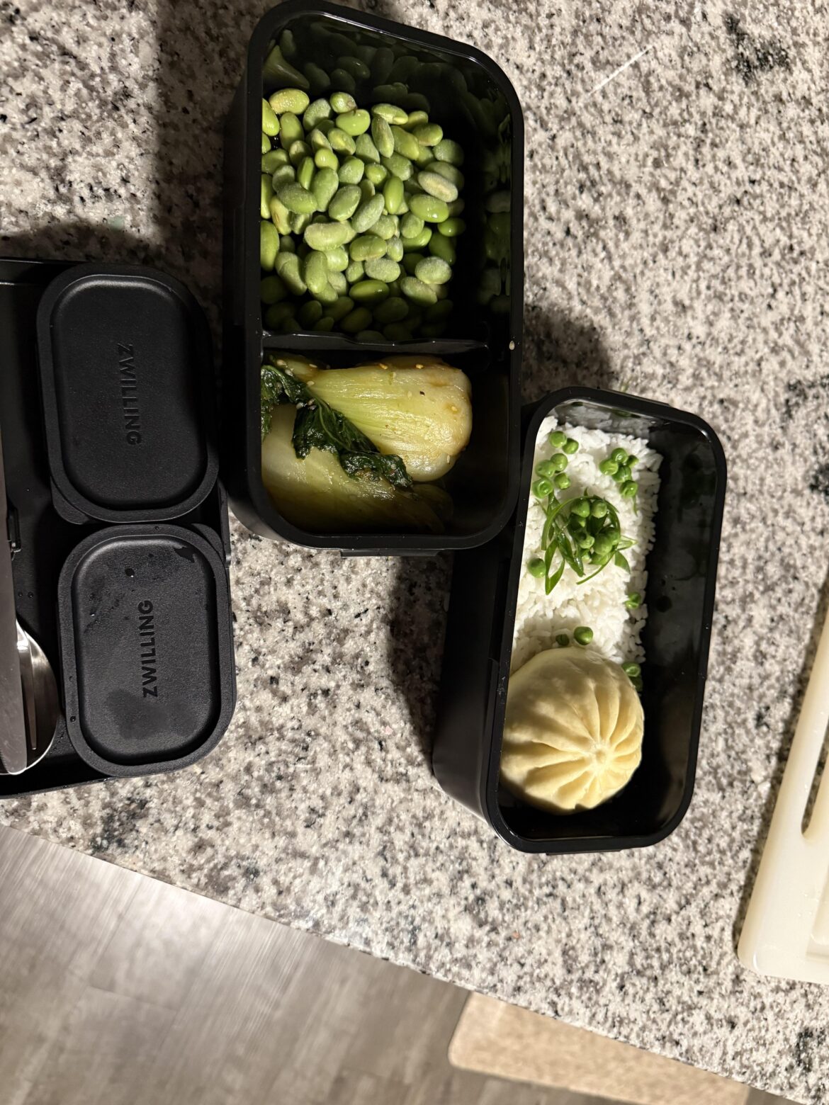 I bought a new bento box. A bao, white rice, edamame and baby bok choy