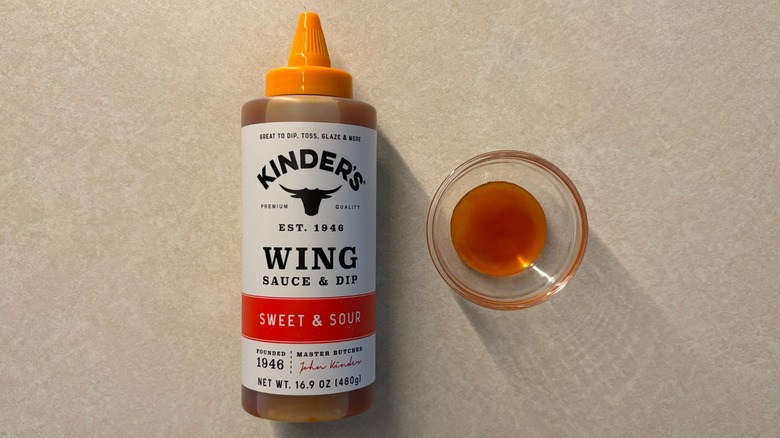 Kinder's Sweet and Sour Wing Sauce and Dip bottle and sauce in glass ramekin