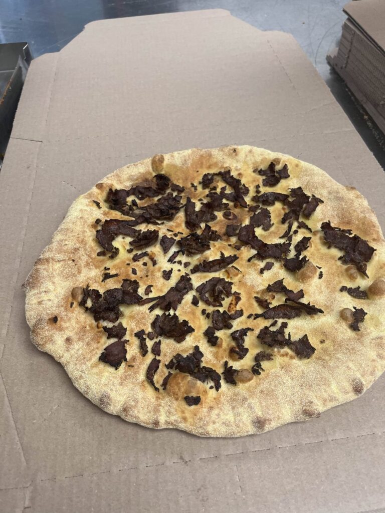 A pizza someone ordered at my store, exactly how they wanted it.