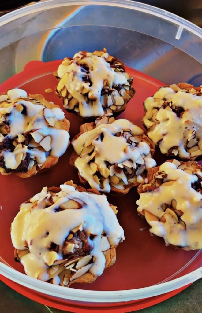 I always bake something for my boyfriends' breakfast. These are Nutella muffins with toasted almonds & vanilla cream cheese glaze.