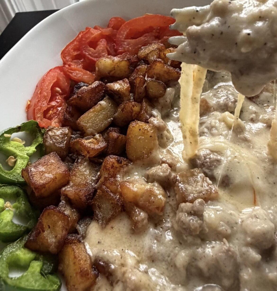 Cheesy Sausage Gravy over Homemade Hashbrowns. Is this too much cheese for breakfast?
