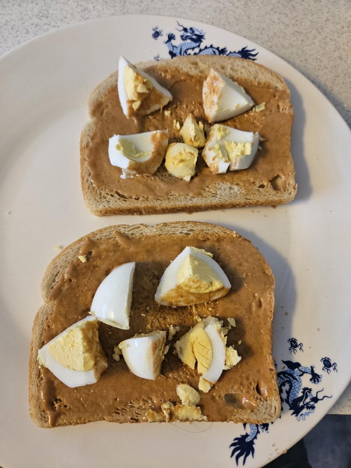 My go to breakfast. Peanut butter toast with a hard boiled egg on top. My kids gag whenever they see me make it
