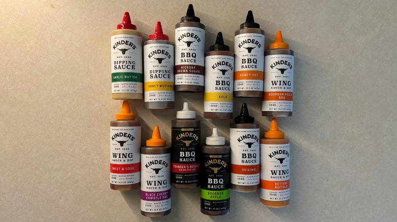 12 Kinder's sauce bottles laid down at angles