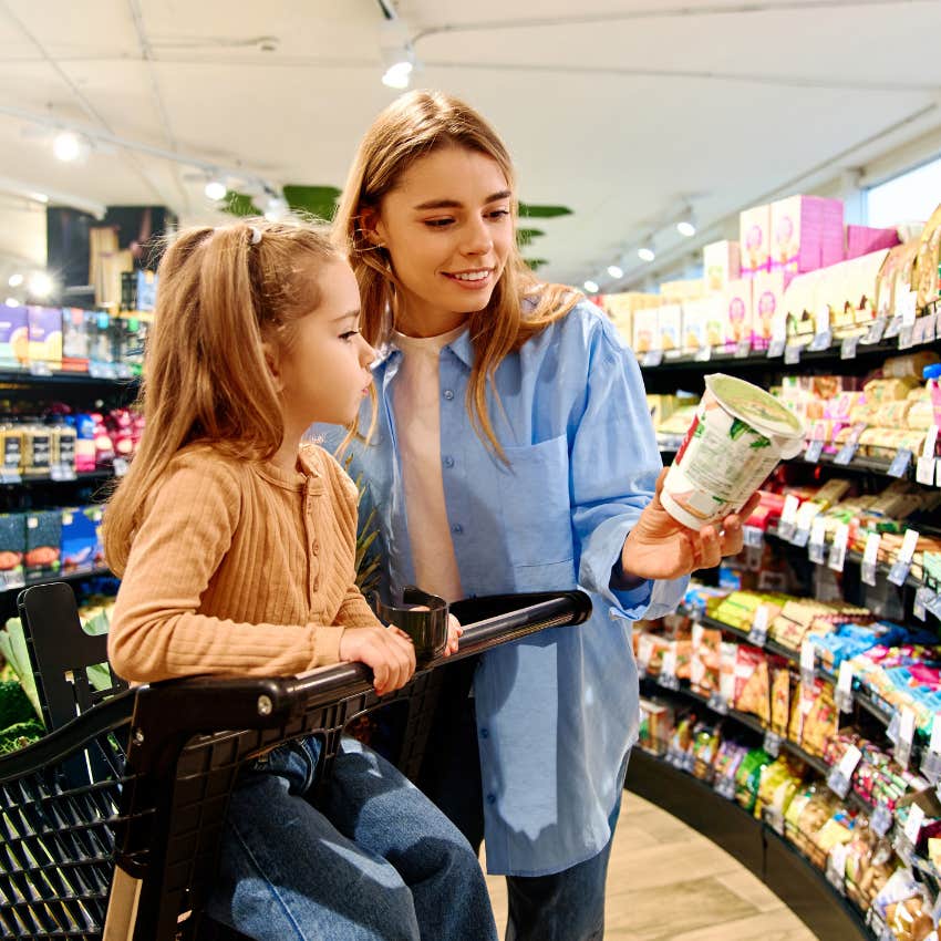 mom grocery shopping with her daughter