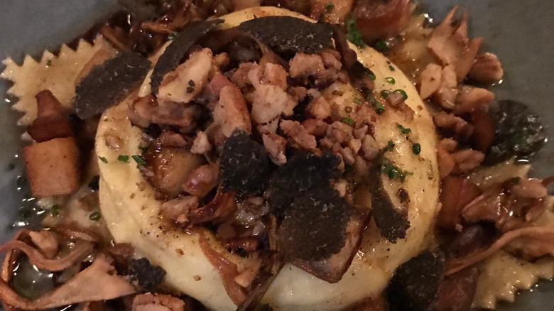 Close-up of plated egg yolk raviolo at Monteverde Restaurant & Pastifico in Chicago, Illinois