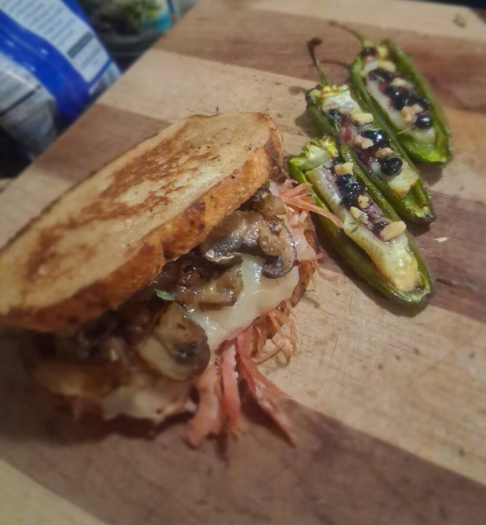 Smoked a ham on the kettle and made a pulled ham sandwich. Pulled ham, havarit cheese, balsamic sautéed mushrooms, a healthy dose of Dijon mustard, between toast sour dough. Served with Jalapeño poppers stuffed with brie cheese, topped with blueberry preserves, chopped walnuts, and a little thyme 😎