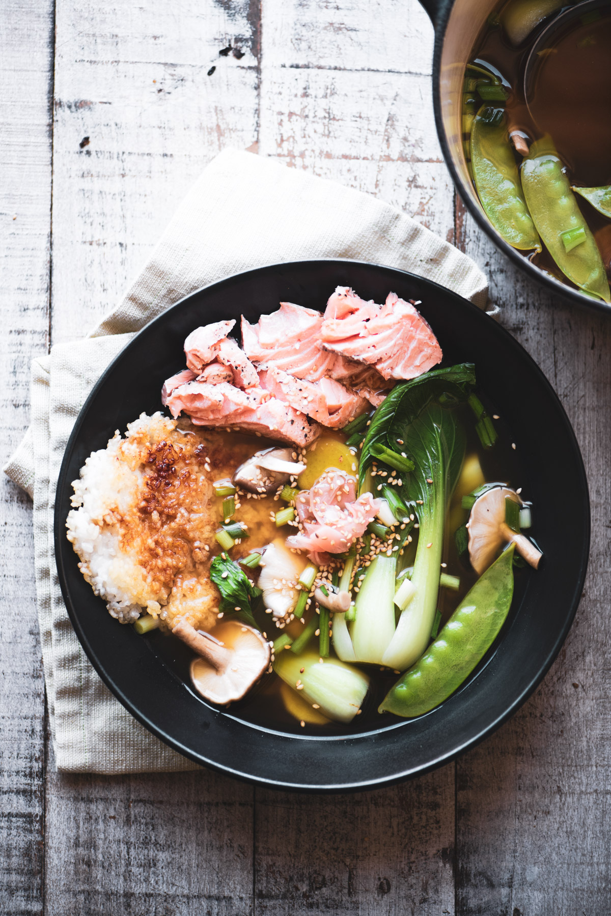 ochazuke ~ Japanese steeped rice and salmon in a black bowl