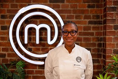 Chef Natasha poses in the MasterChef studio 