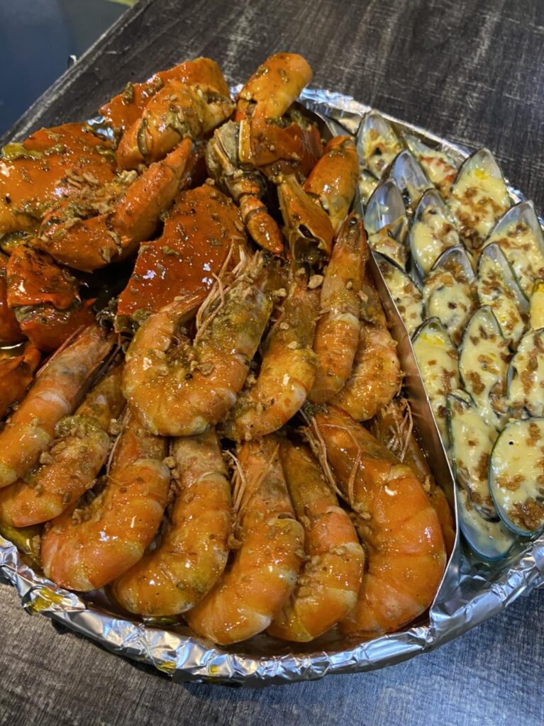 Juicy prawns, meaty crab pieces, and cheesy baked mussels drenched in a rich, savory sauce messy hands guaranteed, but totally worth it. Perfect spread for sharing