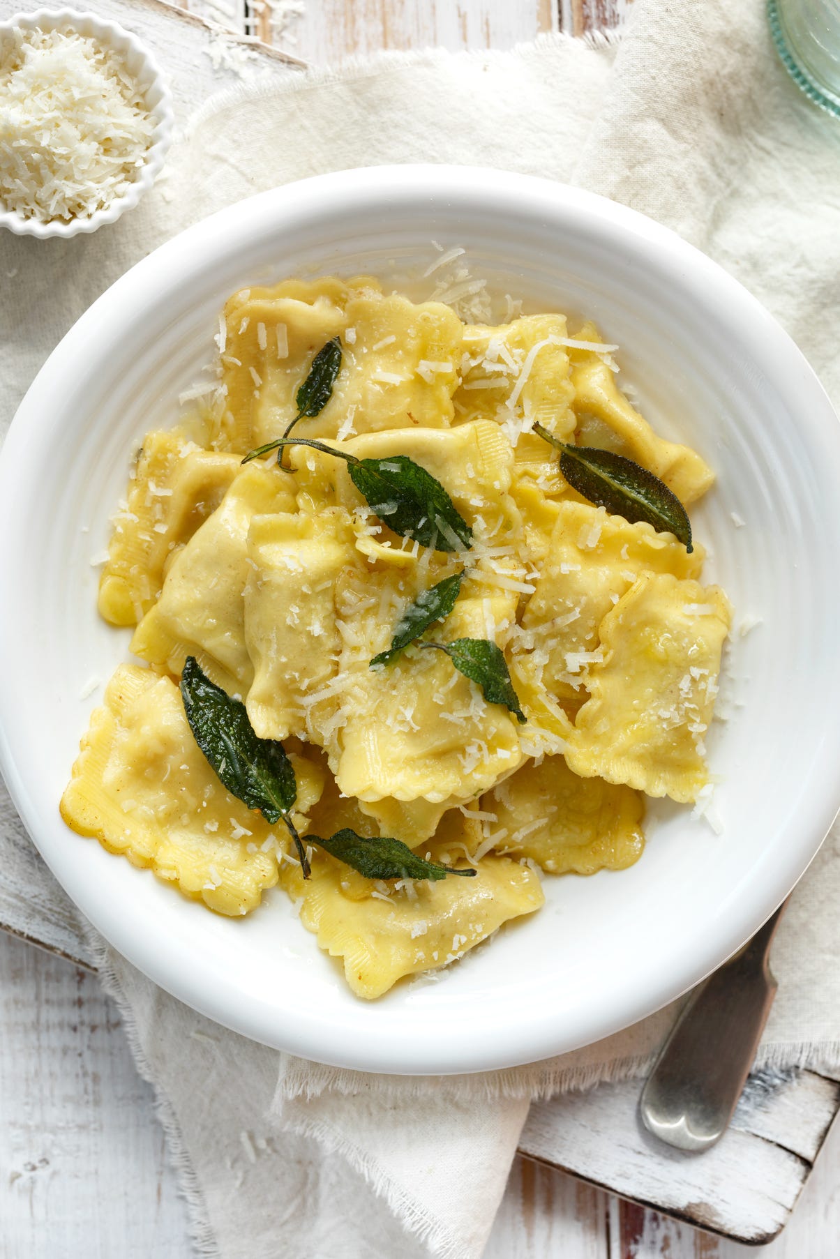 Ravioli with sage butter sprinkled with grana padano cheese