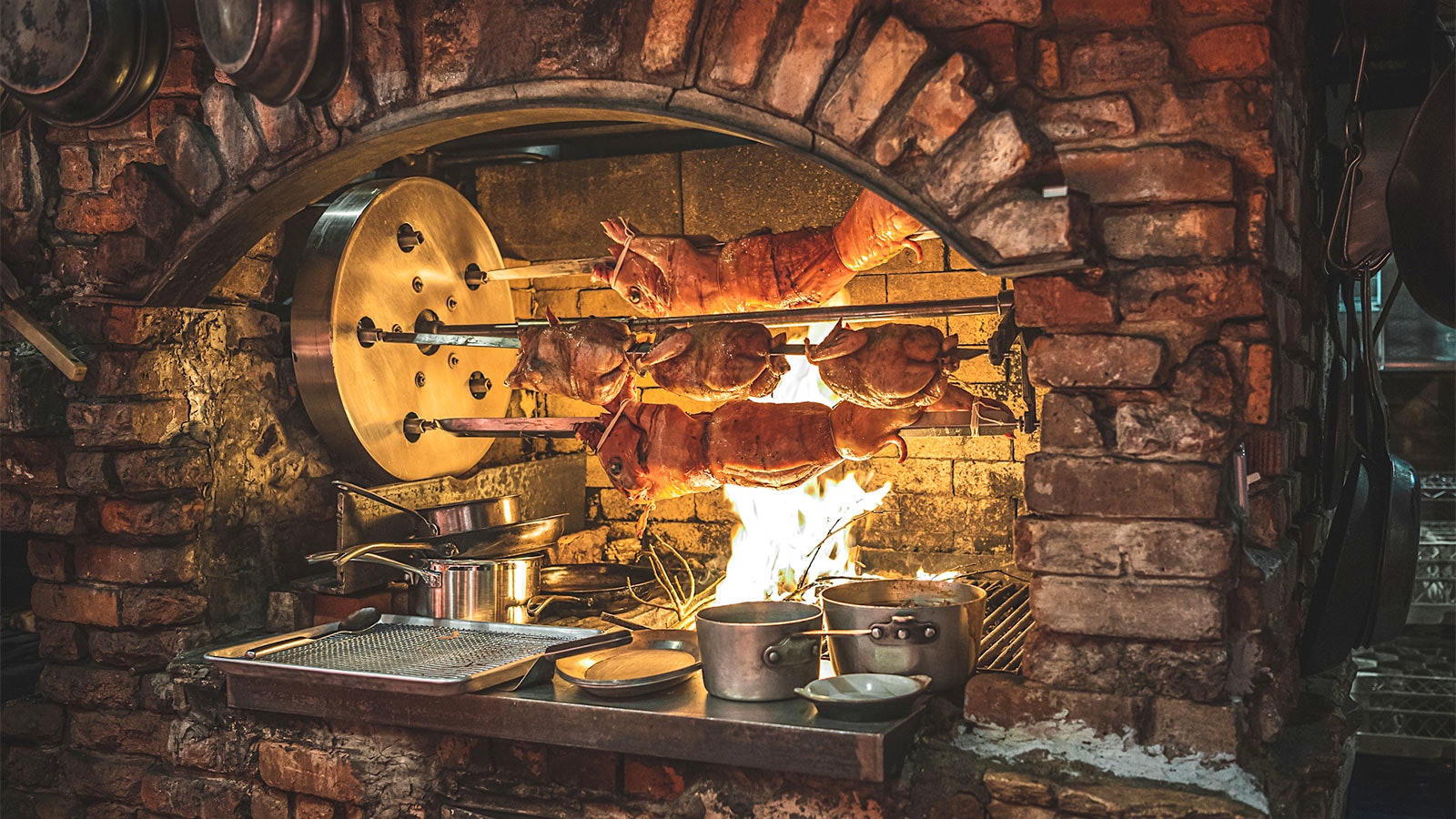  Pigs on a spit at Peasant in New York City