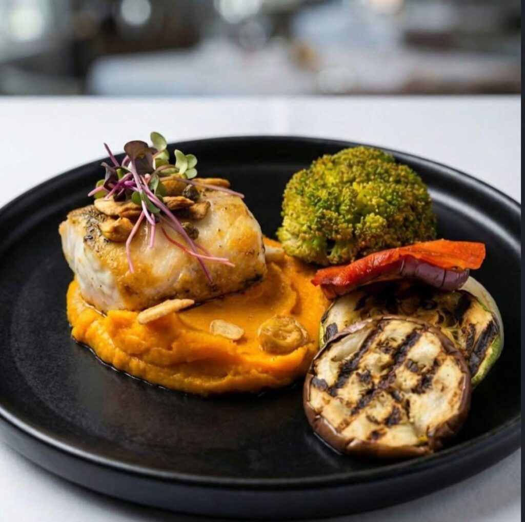 Pan-Seared Sea Bass over a Silky Carrot Purée, served with Charred Broccolini, Eggplant, and Zucchini [OC]