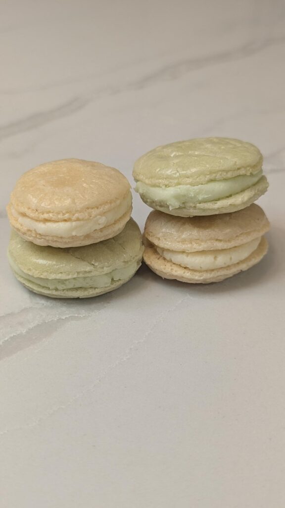 First attempt at macarons. I got a bit of feet action, but every shell is cracked and flat. Tips for next time? First attempt at macarons. I got a bit of feet action, but every shell is cracked and flat. Tips for next time?