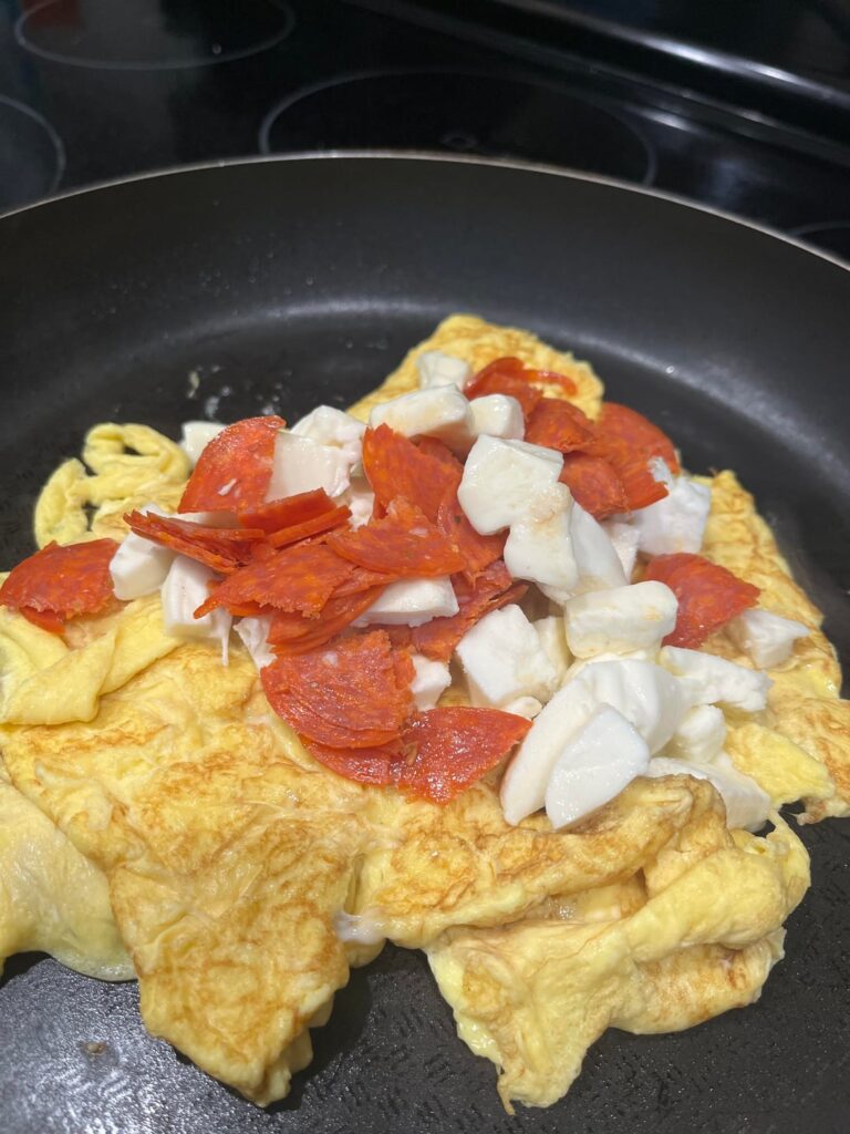 Pizza omelette. Mozzarella Cheese, Pepperoni and Eggs. With our favorite sauce.