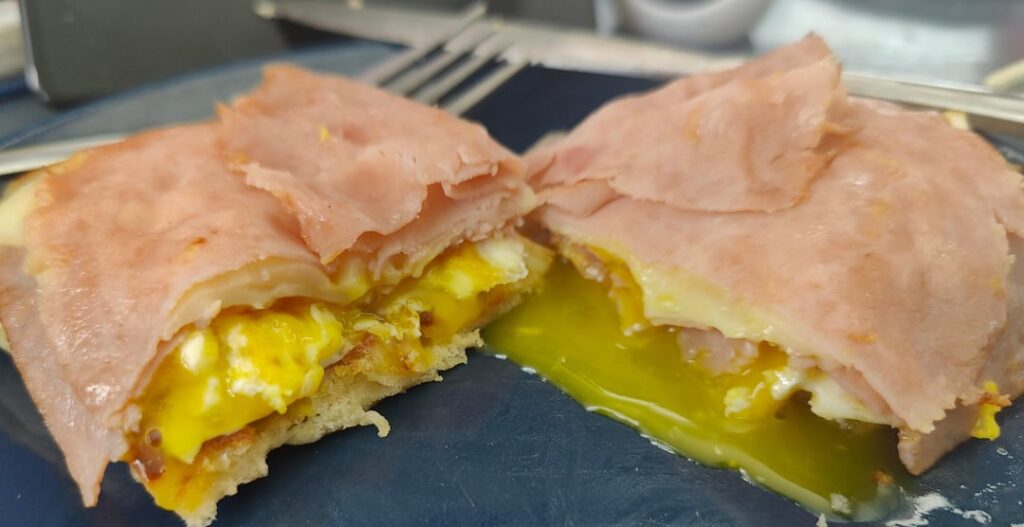 Fried bread, fried egg, ham and Swiss cheese.  New bread from Trader Joes