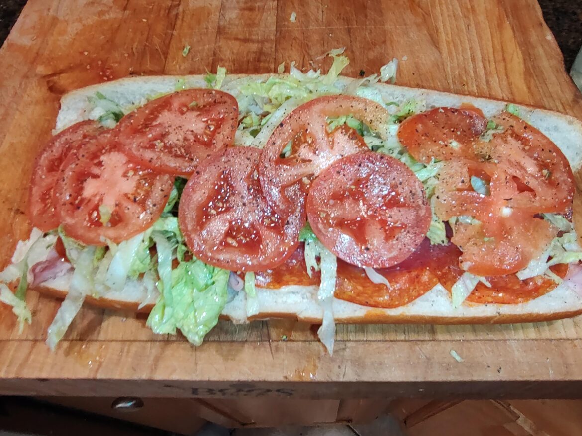 Ham pepperoni salami & provolone heated then topped lettuce tomato red onion oil/vinegar