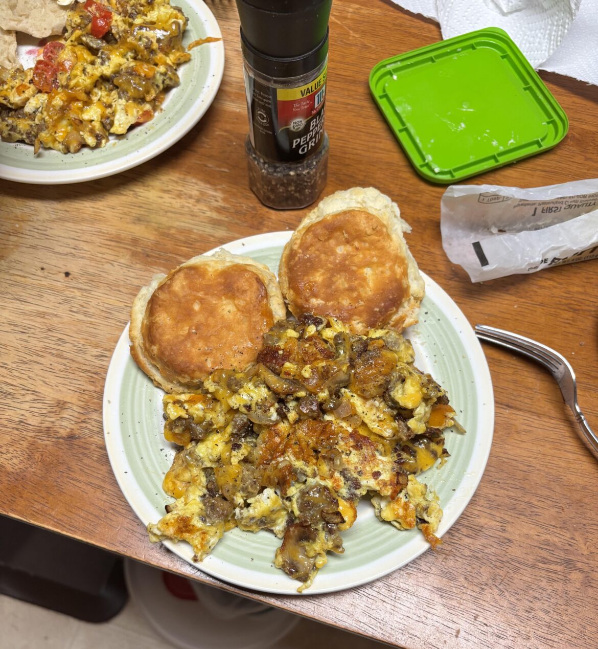 Breakfast for dinner! Scrambles with sausage, mushroom, onion, orange bell pepper, and cheddar with a side of biscuits!