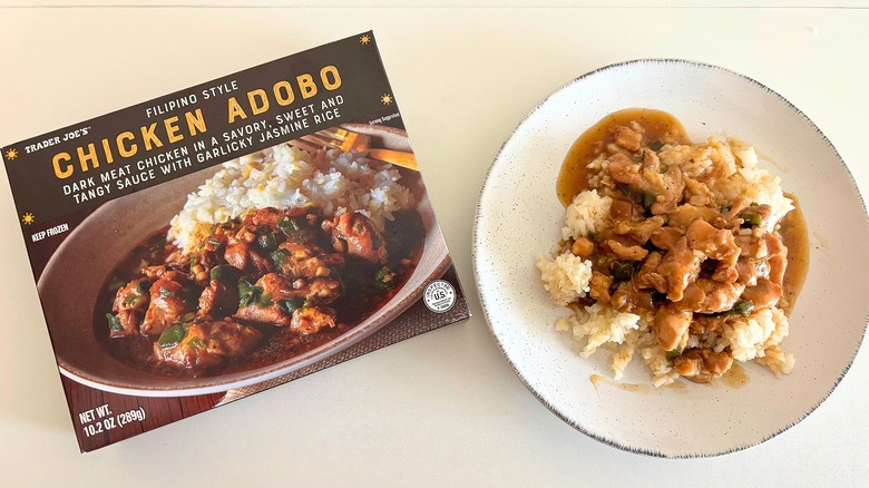 Trader Joe's Chicken Adobo on a plate next to a box on a white table