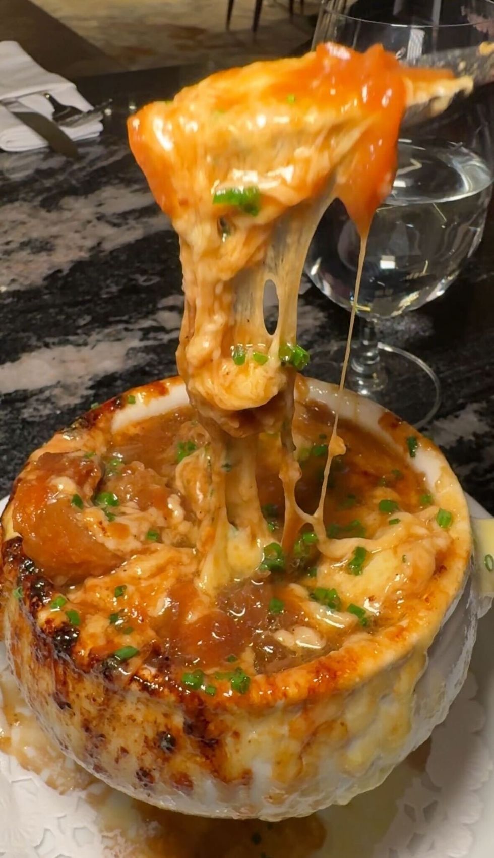 Stringy cheese of a french onion soup.