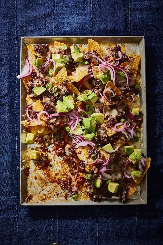 bbq beef nachos on a sheet tray