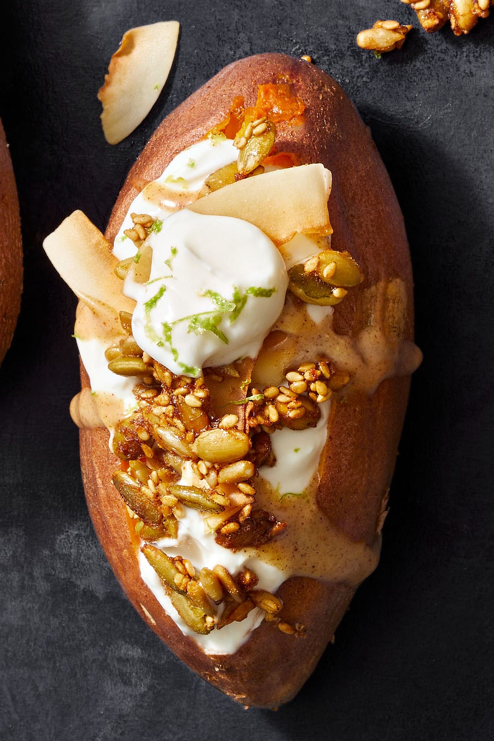sweet potatoes with yogurt, almond butter and pepita granola