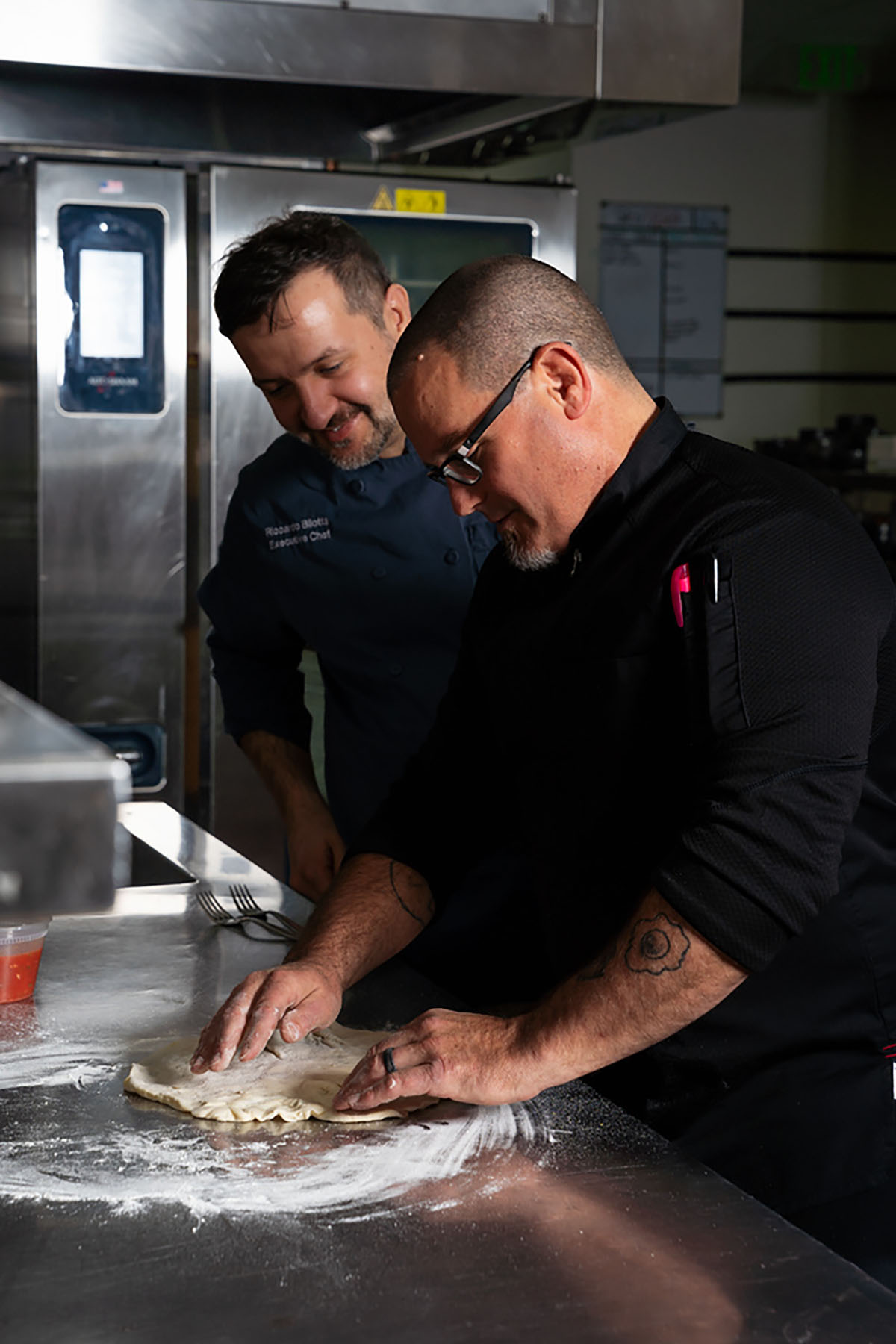 Chefs Riccardo Bilotta, left, and Jason Luke in the kitchen...